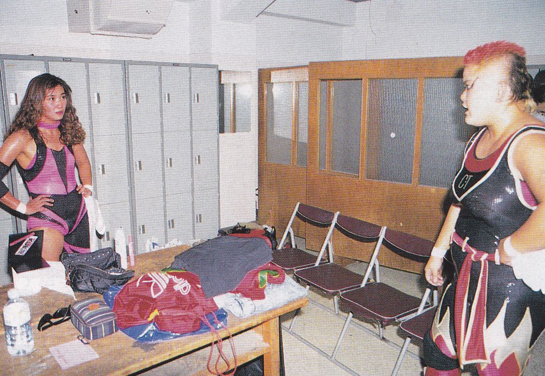 Combat Toyoda and Megumi Kudo standing backstage
